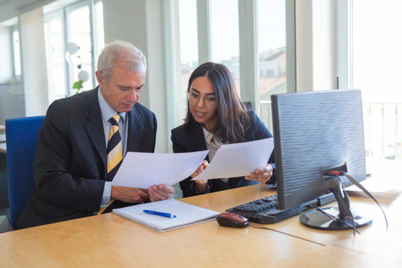 A man and woman reviewing documents